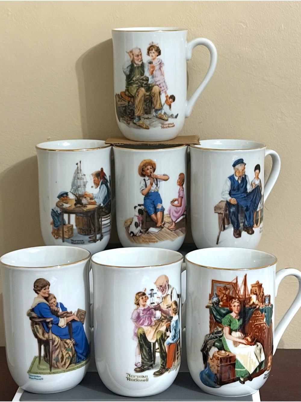 Norman Rockwell Museum 1982 Set of 7 Porcelain Mugs Made in Japan Gold 
Trim